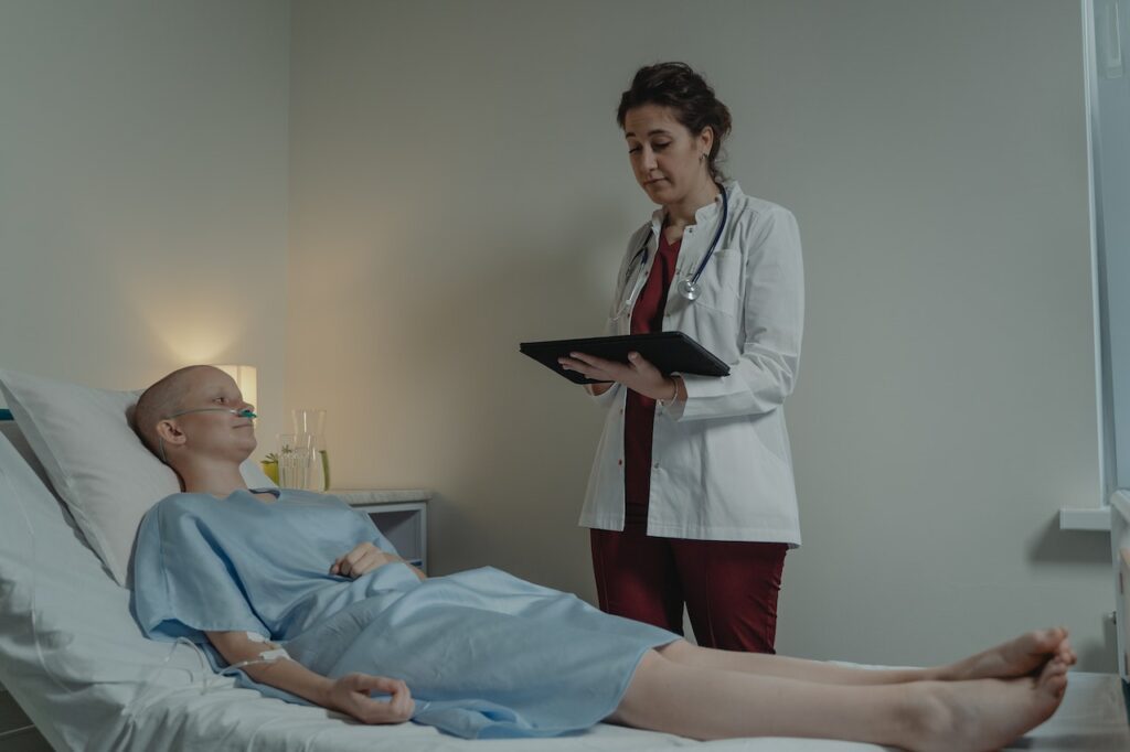 Medical professionals reviewing patient charts in a hospital setting.