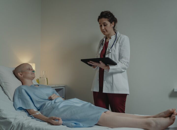 Medical professionals reviewing patient charts in a hospital setting.